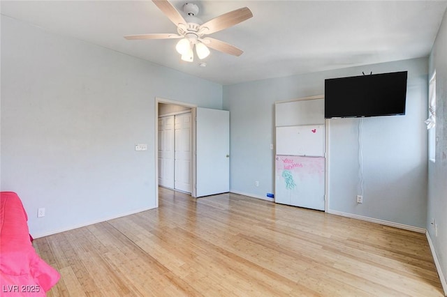 3673 Calypso Beach Ct, Las Vegas, NV 89115 - unfurnished bedroom with light wood-style flooring and ceiling fan