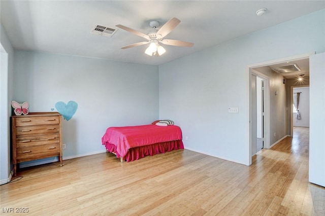 3673 Calypso Beach Ct, Las Vegas, NV 89115 - bedroom featuring wood finished floors, attic access, and ceiling fan