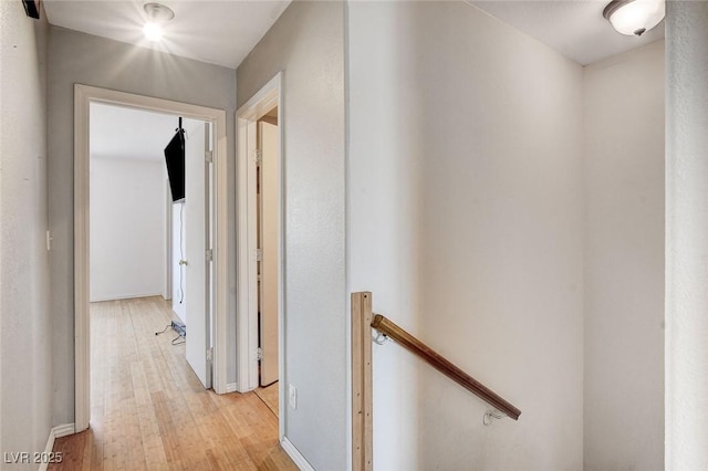 3673 Calypso Beach Ct, Las Vegas, NV 89115 - hallway with an upstairs landing and light wood-type flooring