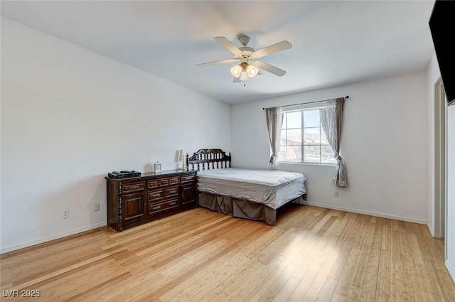 3673 Calypso Beach Ct, Las Vegas, NV 89115 - bedroom with light wood-style floors and ceiling fan