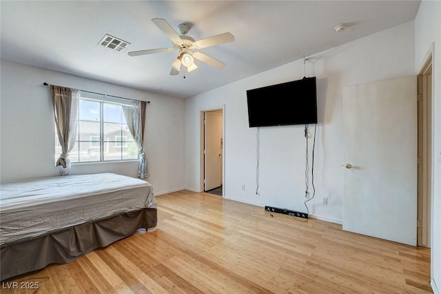 3673 Calypso Beach Ct, Las Vegas, NV 89115 - bedroom with light wood-style floors and a ceiling fan
