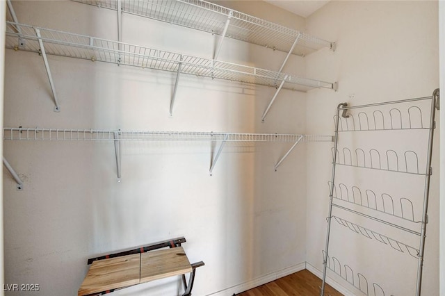 3673 Calypso Beach Ct, Las Vegas, NV 89115 - walk in closet featuring wood finished floors