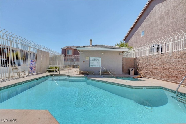 3673 Calypso Beach Ct, Las Vegas, NV 89115 - community pool featuring a hot tub