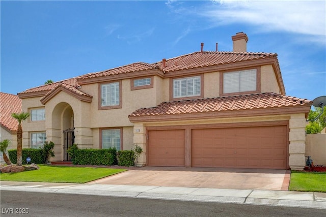 7613 Hackensack Ct, Las Vegas, NV 89128 - mediterranean / spanish home featuring a tile roof, driveway, stucco siding, a chimney, and an attached garage