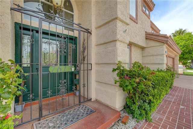 7613 Hackensack Ct, Las Vegas, NV 89128 - property entrance with a garage and stucco siding