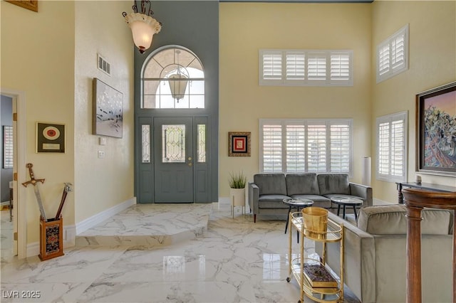 7613 Hackensack Ct, Las Vegas, NV 89128 - entrance foyer with a towering ceiling, plenty of natural light, and marble finish floors