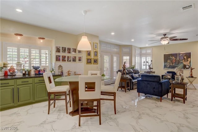 7613 Hackensack Ct, Las Vegas, NV 89128 - dining room with plenty of natural light, a ceiling fan, light marble finish flooring, and recessed lighting