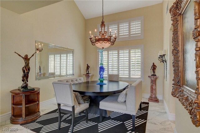 7613 Hackensack Ct, Las Vegas, NV 89128 - dining area featuring marble look tile flooring and a chandelier