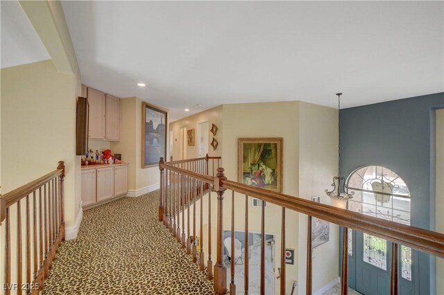 7613 Hackensack Ct, Las Vegas, NV 89128 - corridor with an upstairs landing, light carpet, and recessed lighting