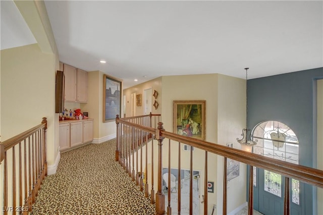 7613 Hackensack Ct, Las Vegas, NV 89128 - corridor with an upstairs landing, light carpet, and recessed lighting