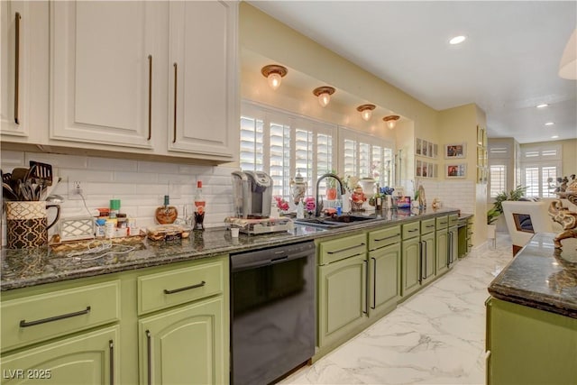 7613 Hackensack Ct, Las Vegas, NV 89128 - kitchen featuring dishwasher, green cabinets, dark stone countertops, light marble finish flooring, and backsplash