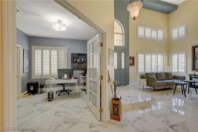 7613 Hackensack Ct, Las Vegas, NV 89128 - office area featuring marble tiled floors, a high ceiling, and french doors