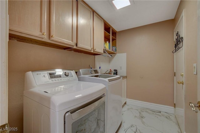 7613 Hackensack Ct, Las Vegas, NV 89128 - laundry area featuring cabinet space, washing machine and dryer, and light marble finish flooring