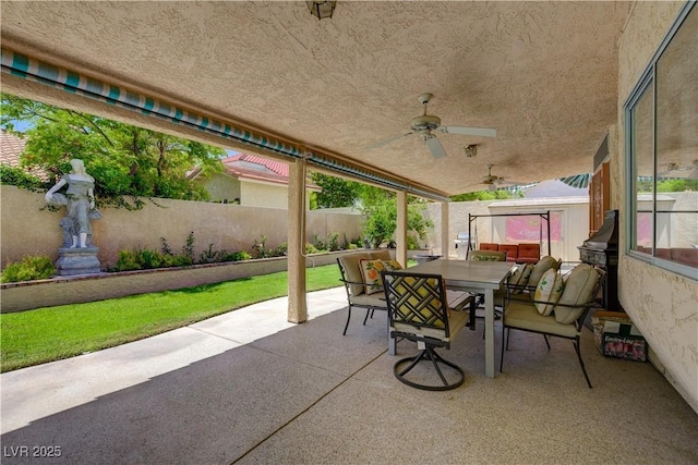 7613 Hackensack Ct, Las Vegas, NV 89128 - fenced backyard with outdoor dining space, a patio area, and a ceiling fan