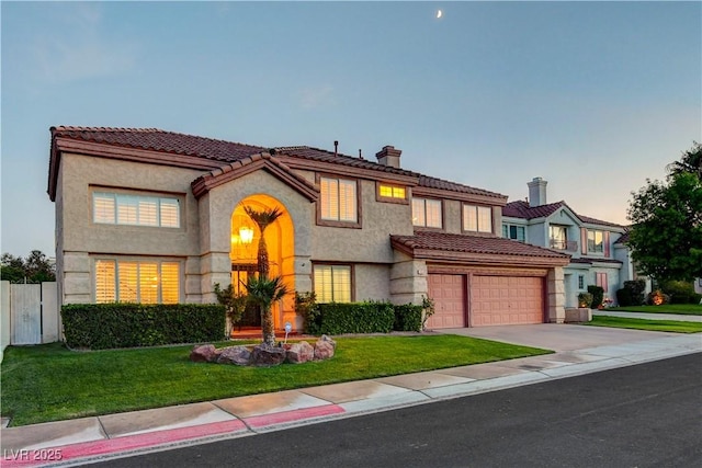 7613 Hackensack Ct, Las Vegas, NV 89128 - mediterranean / spanish house featuring driveway, a chimney, stucco siding, and a tile roof