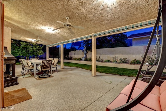 7613 Hackensack Ct, Las Vegas, NV 89128 - fenced backyard featuring outdoor dining space, a ceiling fan, and a patio