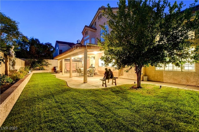 7613 Hackensack Ct, Las Vegas, NV 89128 - back of house with a fenced backyard, stucco siding, and a patio area