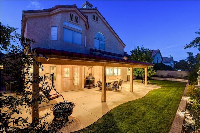 7613 Hackensack Ct, Las Vegas, NV 89128 - rear view of house with a chimney, stucco siding, and a patio