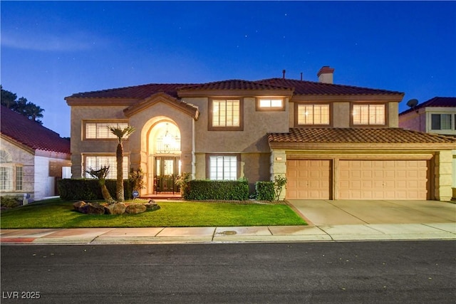 7613 Hackensack Ct, Las Vegas, NV 89128 - mediterranean / spanish house featuring a chimney, a tiled roof, driveway, stucco siding, and an attached garage