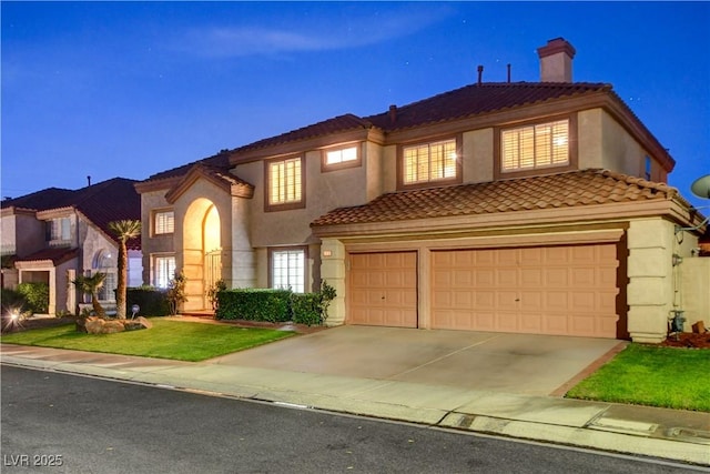7613 Hackensack Ct, Las Vegas, NV 89128 - mediterranean / spanish house with concrete driveway, a chimney, a tile roof, stucco siding, and an attached garage