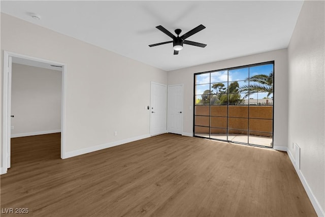 5174 S Jones Blvd Unit 105, Las Vegas, NV 89118 - empty room with wood finished floors and ceiling fan