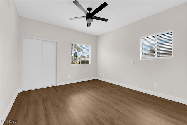 5174 S Jones Blvd Unit 105, Las Vegas, NV 89118 - unfurnished bedroom with wood finished floors, a closet, and a ceiling fan
