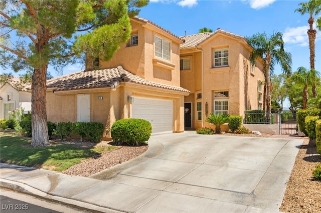 9136 Eagle Ridge Dr, Las Vegas, NV 89134 - mediterranean / spanish-style house with stucco siding, a tiled roof, a garage, driveway, and a gate