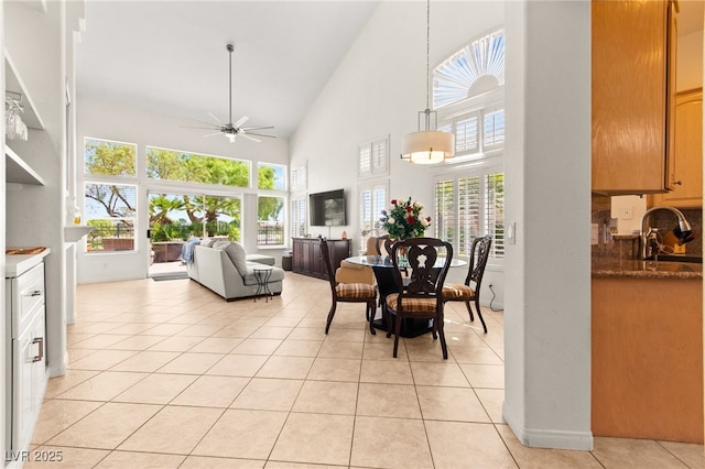 9136 Eagle Ridge Dr, Las Vegas, NV 89134 - dining area featuring high vaulted ceiling, a ceiling fan, and light tile patterned floors