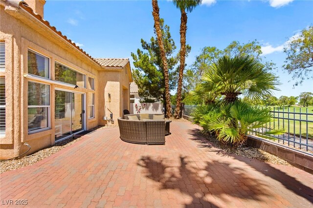 9136 Eagle Ridge Dr, Las Vegas, NV 89134 - fenced backyard with outdoor lounge area and a patio