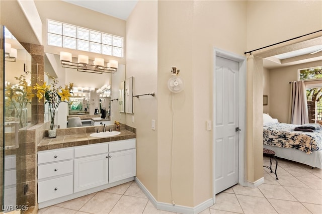 9136 Eagle Ridge Dr, Las Vegas, NV 89134 - ensuite bathroom featuring vanity, tile patterned floors, a towering ceiling, and a shower stall