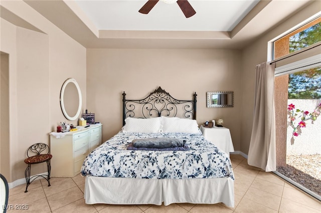 9136 Eagle Ridge Dr, Las Vegas, NV 89134 - bedroom with light tile patterned floors, access to exterior, a raised ceiling, and ceiling fan