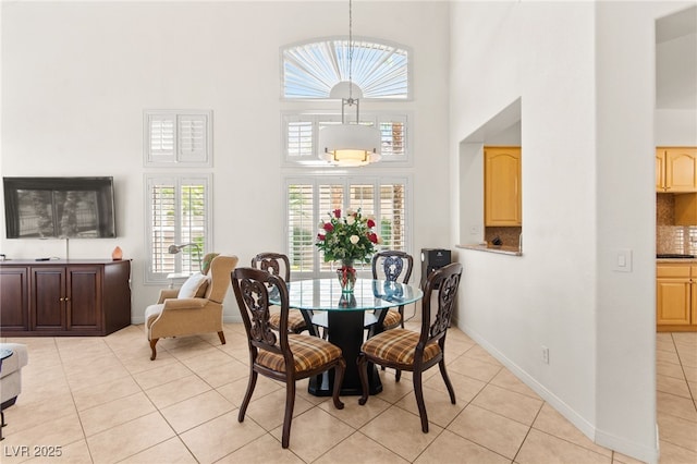 9136 Eagle Ridge Dr, Las Vegas, NV 89134 - dining area featuring a towering ceiling and light tile patterned floors