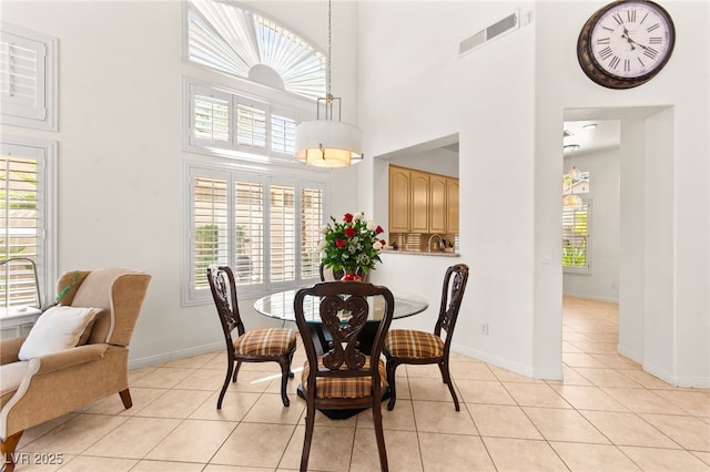 9136 Eagle Ridge Dr, Las Vegas, NV 89134 - dining room with a high ceiling and light tile patterned floors