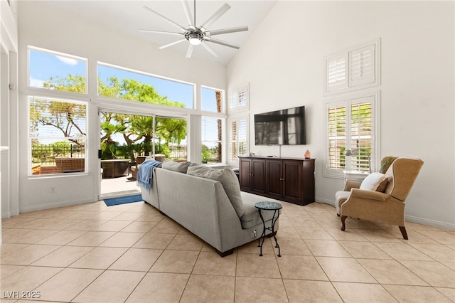 9136 Eagle Ridge Dr, Las Vegas, NV 89134 - living area with high vaulted ceiling, a ceiling fan, plenty of natural light, and light tile patterned flooring