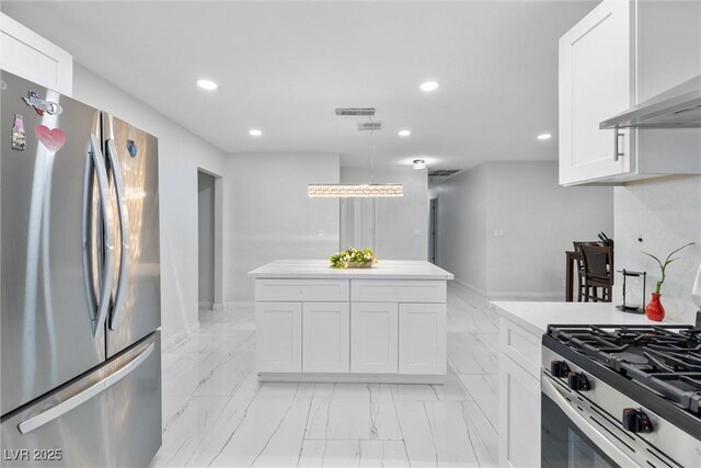 3361 Horizon St, Las Vegas, NV 89121 - kitchen with stainless steel appliances, light marble finish floors, recessed lighting, island exhaust hood, and white cabinetry