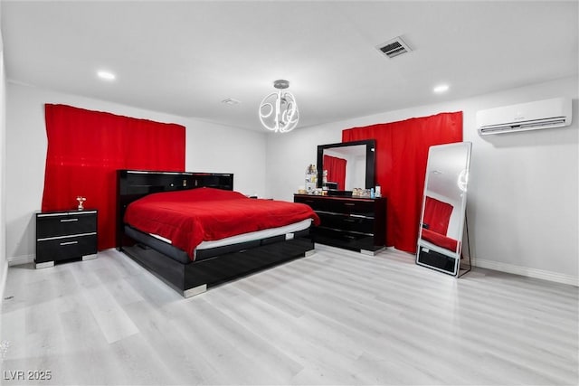 3361 Horizon St, Las Vegas, NV 89121 - bedroom featuring a wall unit AC, wood finished floors, and recessed lighting