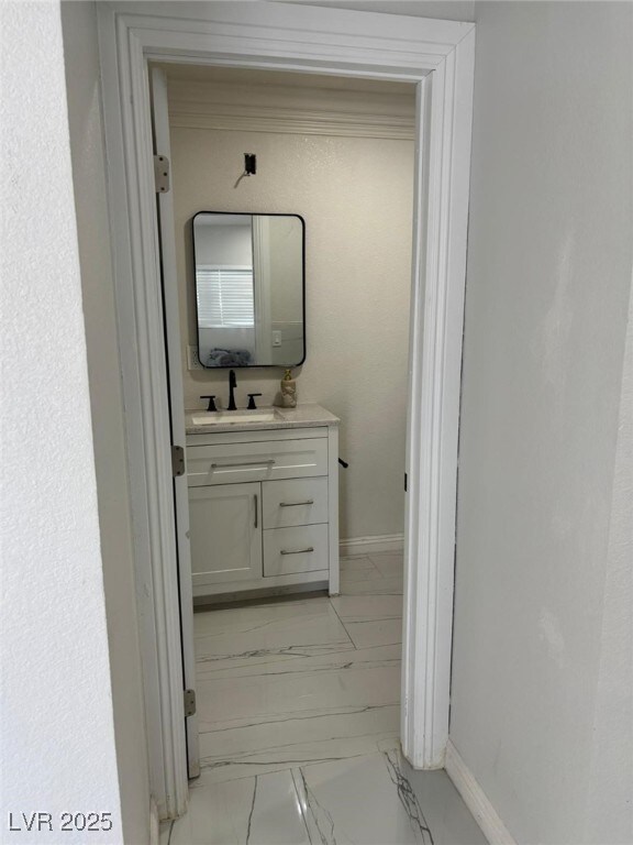 3361 Horizon St, Las Vegas, NV 89121 - corridor with light marble finish floors and a sink