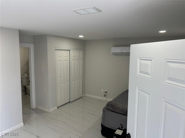 3361 Horizon St, Las Vegas, NV 89121 - bedroom featuring light marble finish floors, a wall mounted air conditioner, recessed lighting, and a closet