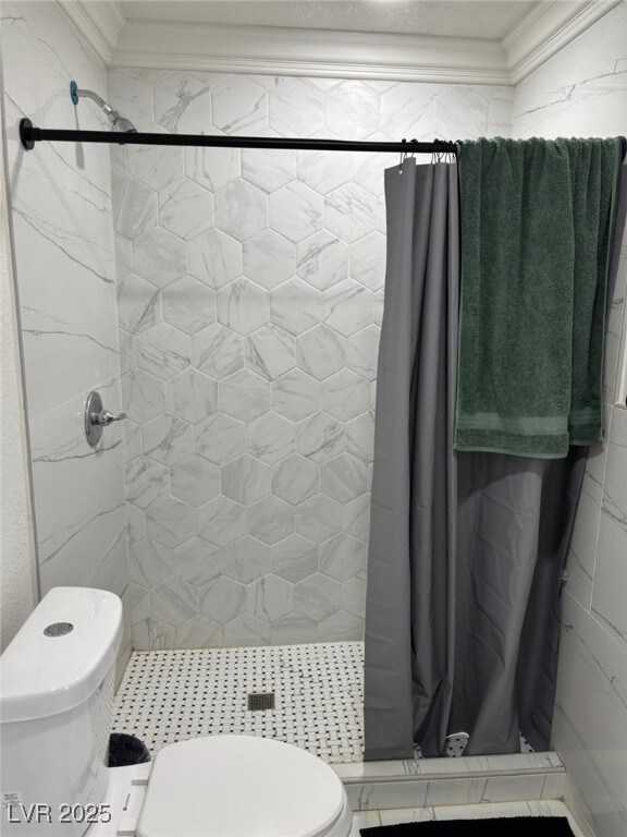 3361 Horizon St, Las Vegas, NV 89121 - bathroom featuring crown molding and a shower stall