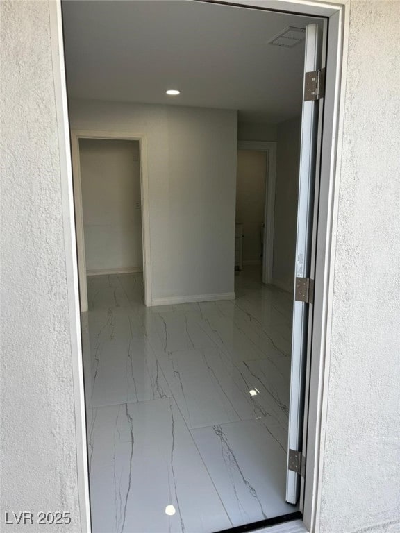 3361 Horizon St, Las Vegas, NV 89121 - hallway featuring marble finish floors and recessed lighting