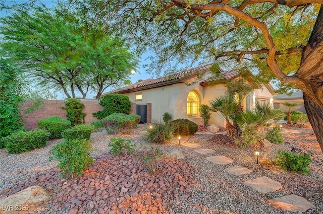 212 Florio Ct, Las Vegas, NV 89138 - view of side of home with stucco siding and a tile roof