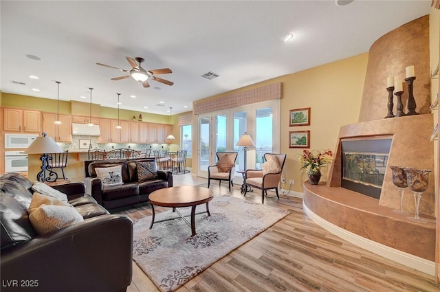 212 Florio Ct, Las Vegas, NV 89138 - living area featuring light wood-style floors, a ceiling fan, and recessed lighting