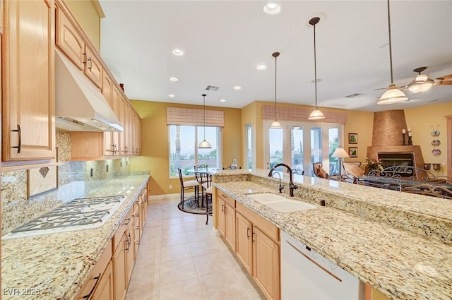 212 Florio Ct, Las Vegas, NV 89138 - kitchen featuring white dishwasher, gas stovetop, light brown cabinetry, a fireplace, and recessed lighting