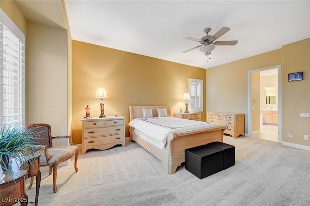 212 Florio Ct, Las Vegas, NV 89138 - bedroom with light carpet, ensuite bathroom, and a ceiling fan