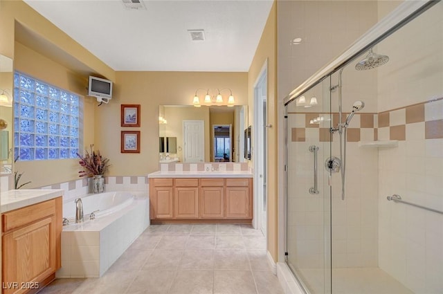 212 Florio Ct, Las Vegas, NV 89138 - full bathroom featuring a stall shower, a garden tub, vanity, and tile patterned floors