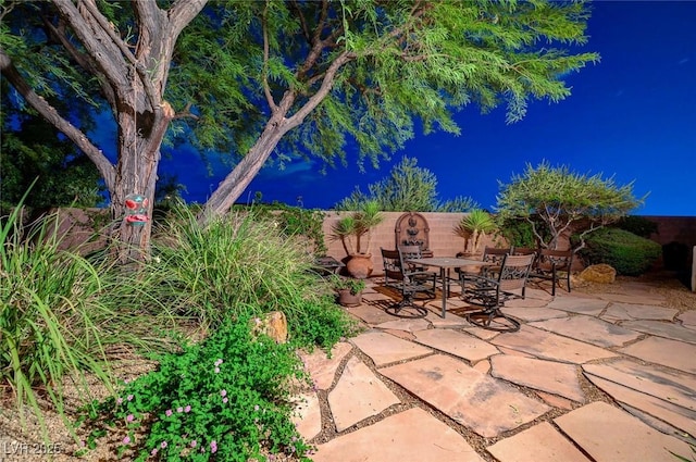 212 Florio Ct, Las Vegas, NV 89138 - fenced backyard featuring outdoor dining space and a patio area