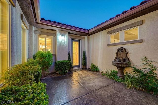 212 Florio Ct, Las Vegas, NV 89138 - property entrance featuring stucco siding, a patio area, and a tile roof