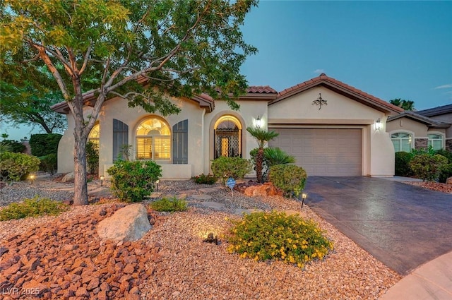 212 Florio Ct, Las Vegas, NV 89138 - mediterranean / spanish home featuring a garage, concrete driveway, stucco siding, and a tile roof