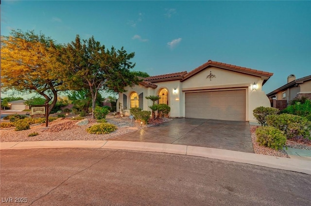 212 Florio Ct, Las Vegas, NV 89138 - mediterranean / spanish home with an attached garage, stucco siding, concrete driveway, and a tiled roof