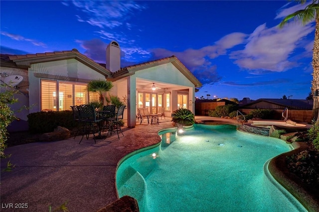 212 Florio Ct, Las Vegas, NV 89138 - view of swimming pool featuring a patio area, a fenced backyard, and a pool with connected hot tub